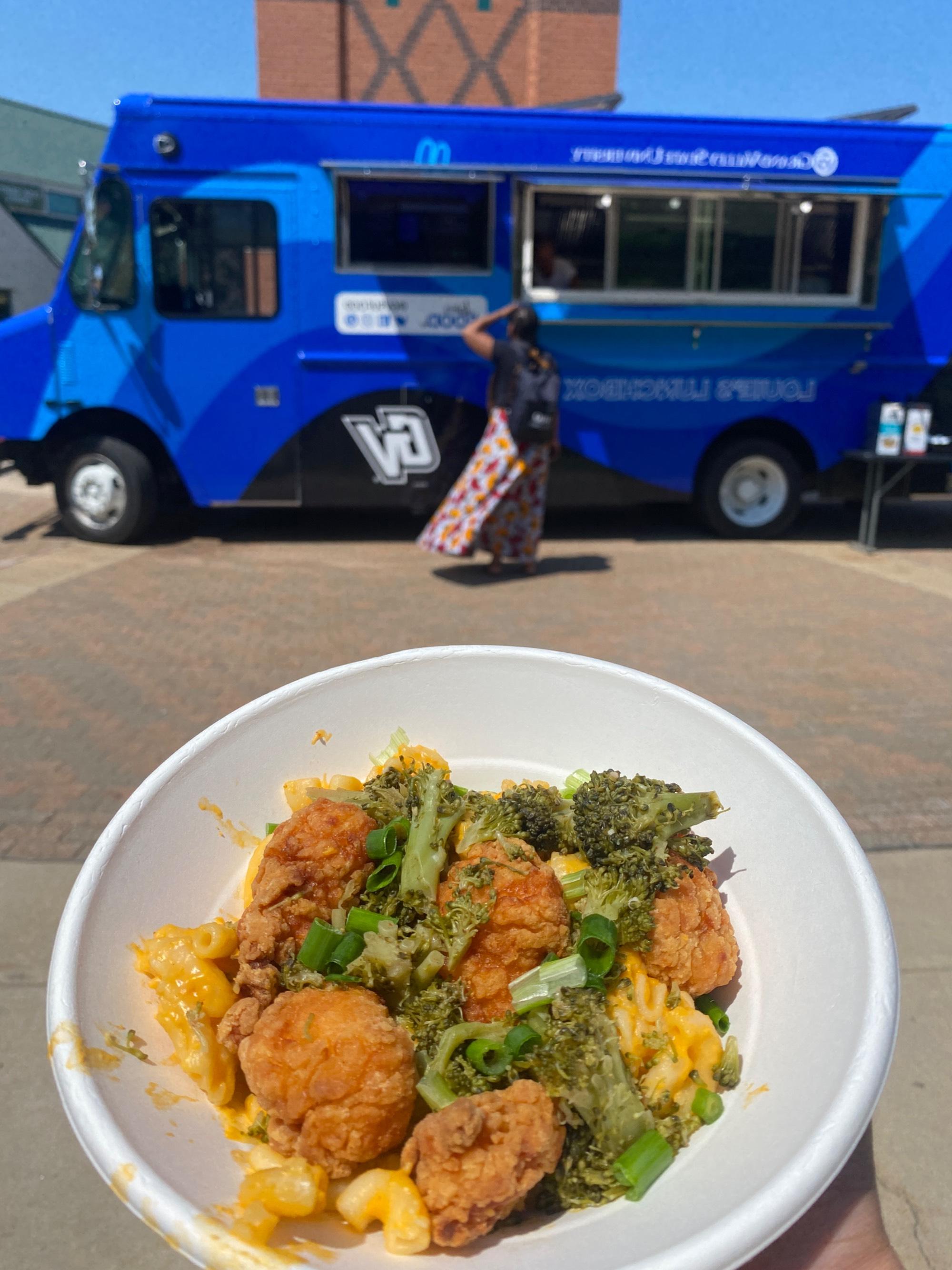 Mac & Cheese with crispy chicken tenders and broccoli on top